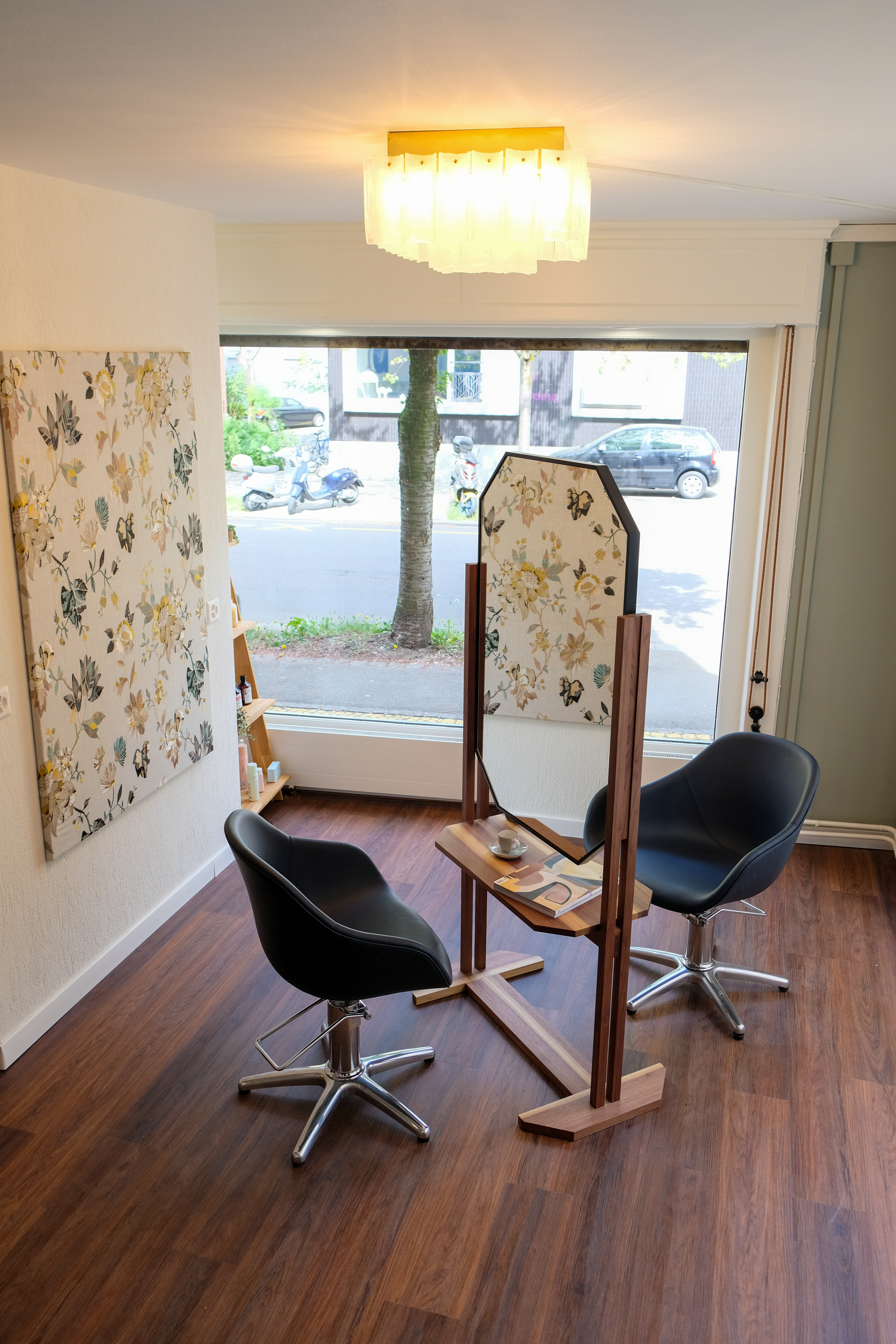 Styling chairs with big window and floral wallpaper